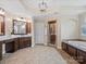 Luxurious primary bathroom with a double vanity, soaking tub, and glass shower at 1030 Westbury Dr, Matthews, NC 28104