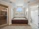 Elegant primary bathroom with soaking tub and tile shower at 1030 Westbury Dr, Matthews, NC 28104