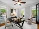 Bright home office featuring neutral walls, a ceiling fan, and ample natural light from large windows at 1030 Westbury Dr, Matthews, NC 28104