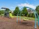 Community playground with slide and swings for fun outdoor activities and recreation at 1030 Westbury Dr, Matthews, NC 28104