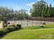 Community tennis courts surrounded by lush greenery and well-maintained landscaping at 1030 Westbury Dr, Matthews, NC 28104