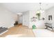 Bright open-concept living room with hardwood floors and decorative shelving at 105 Altondale Dr, Statesville, NC 28625