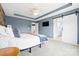 Spacious bedroom features a sliding barn door, modern lighting, and neutral decor at 106 Sweet Briar Dr, Fort Mill, SC 29707