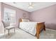 Cozy bedroom features a full bed, and natural light from the window at 106 Sweet Briar Dr, Fort Mill, SC 29707