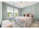 Comfortable bedroom with stylish decor, two windows, and a ceiling fan at 106 Sweet Briar Dr, Fort Mill, SC 29707