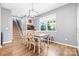 Bright dining area with a wooden table, chairs, and a large window at 106 Sweet Briar Dr, Fort Mill, SC 29707