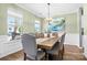 Bright dining room with large windows, stylish chandelier, and a spacious dining table at 106 Sweet Briar Dr, Fort Mill, SC 29707