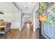 Elegant foyer with hardwood floors, chandelier, and views of the dining and living spaces at 106 Sweet Briar Dr, Fort Mill, SC 29707