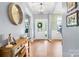 Inviting foyer featuring hardwood floors, decorative lighting, and a glimpse of the home's interior at 106 Sweet Briar Dr, Fort Mill, SC 29707