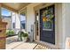 A welcoming front porch features a decorated door, bench, and potted plants for added curb appeal at 106 Sweet Briar Dr, Fort Mill, SC 29707