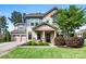Charming two-story home with a welcoming front porch, manicured lawn, and well-kept landscaping at 106 Sweet Briar Dr, Fort Mill, SC 29707