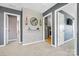 Hallway featuring gray walls, modern wallpaper accent and access to the laundry room at 106 Sweet Briar Dr, Fort Mill, SC 29707