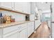 Kitchen features white cabinets, granite countertops and stainless steel appliances at 106 Sweet Briar Dr, Fort Mill, SC 29707