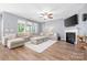 Cozy living room with plush seating, fireplace, and a large TV for entertainment at 106 Sweet Briar Dr, Fort Mill, SC 29707