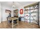 Spacious home office with custom shelving, hardwood floors, and a functional workspace at 106 Sweet Briar Dr, Fort Mill, SC 29707