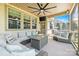 Relaxing screened porch with comfortable seating and a ceiling fan at 106 Sweet Briar Dr, Fort Mill, SC 29707