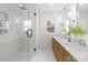 Modern bathroom featuring a glass-enclosed shower, dual sinks, and stylish fixtures for a spa-like experience at 1314 Ordermore Ave, Charlotte, NC 28203