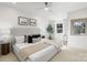 Bright bedroom with modern furnishings, neutral colors, and a ceiling fan provides a relaxing atmosphere at 1314 Ordermore Ave, Charlotte, NC 28203