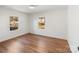 Bright bedroom with hardwood floors, two windows, and ample natural light is move-in ready at 1314 Ordermore Ave, Charlotte, NC 28203