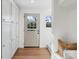Welcoming entryway featuring built-in storage cabinets and a view of the front door at 1314 Ordermore Ave, Charlotte, NC 28203