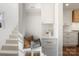 Charming entryway with built-in bench, storage, and a glimpse of the staircase at 1314 Ordermore Ave, Charlotte, NC 28203