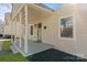 Inviting covered front porch with classic columns and meticulous landscaping at 1314 Ordermore Ave, Charlotte, NC 28203