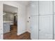 Hallway with view into Kitchen, showing stainless steel refrigerator, island, and white cabinets at 1314 Ordermore Ave, Charlotte, NC 28203