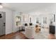 Inviting living room with ample natural light, neutral furniture, and hardwood floors at 1314 Ordermore Ave, Charlotte, NC 28203