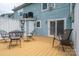 Image displays spacious wooden deck with table and chairs and direct access to townhome at 1404 River Dr, Belmont, NC 28012