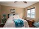 Cozy bedroom featuring a window view and comfortable furnishings, creating a relaxing space at 1404 River Dr, Belmont, NC 28012