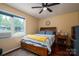 Comfortable bedroom featuring a large window and hardwood floors, providing natural light at 1404 River Dr, Belmont, NC 28012