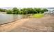 Waterfront view with a concrete boat ramp leading into a calm lake at 1404 River Dr, Belmont, NC 28012
