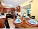 Inviting dining area with a wooden table, seating for four, and a view of the kitchen at 1404 River Dr, Belmont, NC 28012