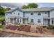 Attractive townhome with colorful landscaping and a welcoming entrance at 1404 River Dr, Belmont, NC 28012