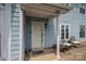 Inviting front door with a charming porch featuring stylish outdoor seating and quaint decor at 1404 River Dr, Belmont, NC 28012