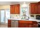 Modern kitchen with stainless steel appliances, ample cabinet space, and a sliding glass door at 1404 River Dr, Belmont, NC 28012