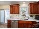 Modern kitchen with stainless steel appliances, a stainless steel sink, and wooden cabinets at 1404 River Dr, Belmont, NC 28012