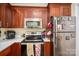 Updated kitchen featuring stainless steel appliances, a microwave, and ample cabinet space at 1404 River Dr, Belmont, NC 28012