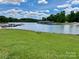 Picturesque lake view showcasing the calm waters and lush greenery at 1404 River Dr, Belmont, NC 28012