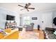 Inviting living room with hardwood floors, ceiling fan, comfortable seating, and bright natural light at 1404 River Dr, Belmont, NC 28012
