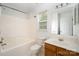 Bathroom with bathtub, toilet, sink and large mirror at 14311 Riding Hill Ave, Charlotte, NC 28213