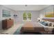 Comfortable bedroom with blue accents, a wide window, and wooden dresser at 14311 Riding Hill Ave, Charlotte, NC 28213