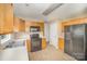 This kitchen has tile floors, stainless steel appliances, and ample counter space at 14311 Riding Hill Ave, Charlotte, NC 28213