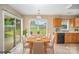Bright dining area adjacent to kitchen with sliding doors to the backyard at 14311 Riding Hill Ave, Charlotte, NC 28213