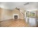Living room with hardwood floors and a fireplace at 14311 Riding Hill Ave, Charlotte, NC 28213