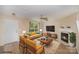 Inviting staged living room boasts natural light, a fireplace, and stylish decor at 14311 Riding Hill Ave, Charlotte, NC 28213