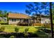 A spacious backyard features a wood deck and a charming screened in porch perfect for outdoor enjoyment at 1680 Beleek Ridge Ln, Clover, SC 29710