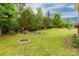 Expansive backyard with mature trees, providing shade and privacy at 1680 Beleek Ridge Ln, Clover, SC 29710