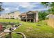 Lush backyard featuring landscaping and a screened-in porch ideal for relaxation at 1680 Beleek Ridge Ln, Clover, SC 29710
