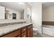 Well-lit bathroom featuring granite countertops, ceramic tile flooring, and a separate shower and tub at 1680 Beleek Ridge Ln, Clover, SC 29710